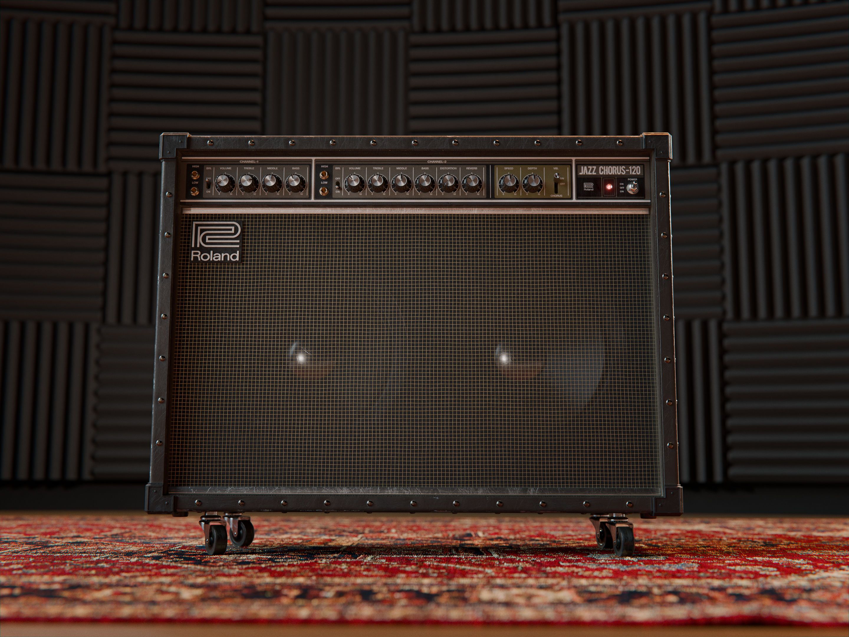 The front of the Roland JC-120, standing on a persian carpet, in front of acoustic panels.
